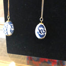 Blue ceramic egg on gold chain